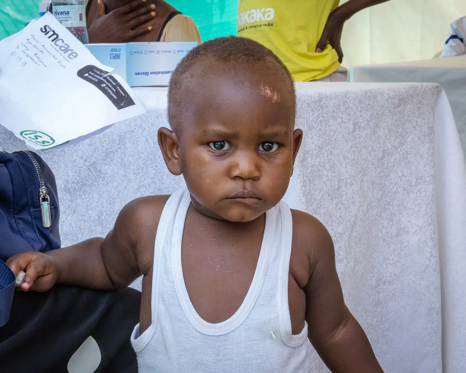 A child at a community outreach